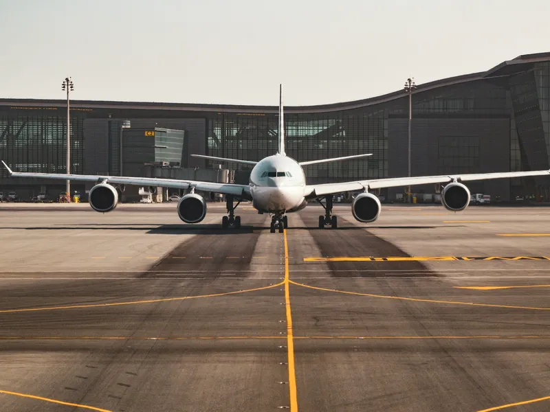 An airliner on the tarmac in front of a terminal building