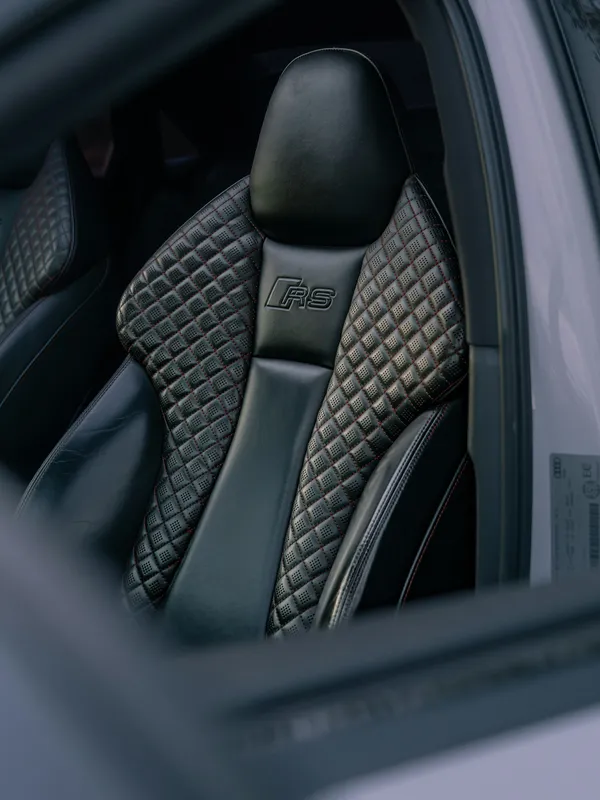 Quilted black leather seats inside a luxury vehicle